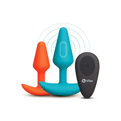 Teal vibrating plug with wireless remote and orange beginner plug from b-Vibe Butties set