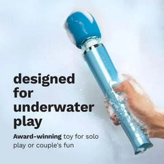 Teal wand massager held under running soapy water, highlighting its submersible waterproof design
