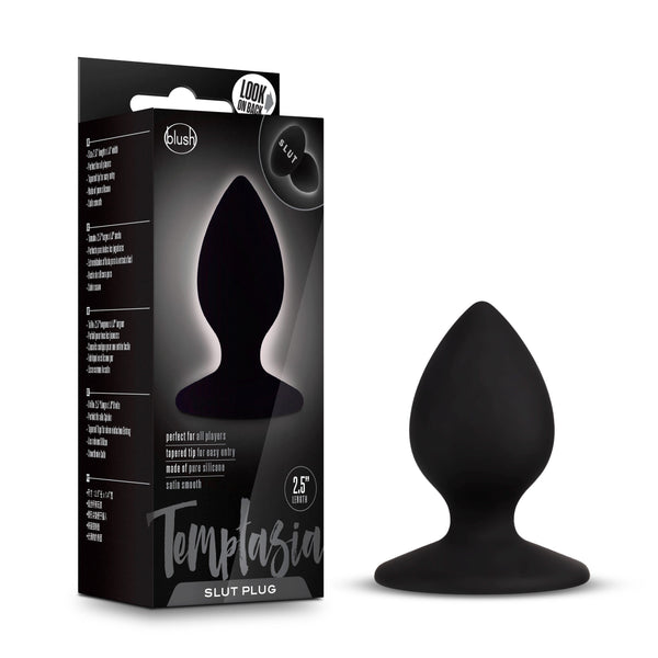 Temptasia Slut Plug beside its black retail box showing product details and branding