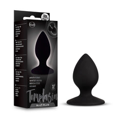 Temptasia Slut Plug beside its black retail box showing product details and branding