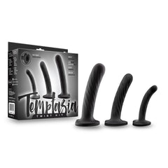 Temptasia Twist Kit packaging beside three black silicone dildos showing small, medium, and large sizes