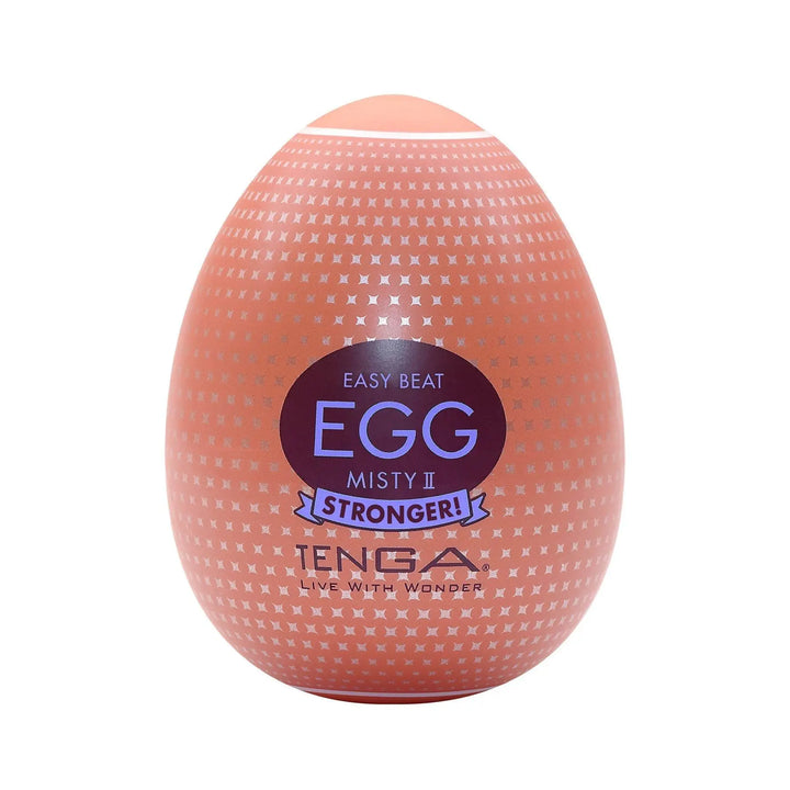Tenga Egg Misty II Hard Boiled masturbator in coral egg-shaped shell with cross-pattern texture