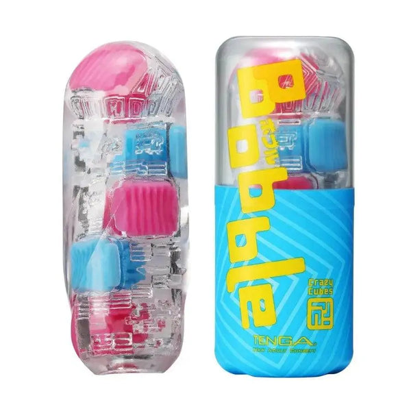 Tenga Bobble Crazy Cubes stroker beside its blue packaging, clear body with pink and blue cube inserts