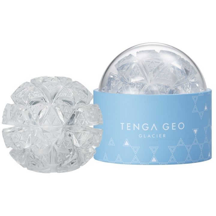 Tenga Geo Glacier stroker beside its light blue cylindrical display case, clear geometric texture
