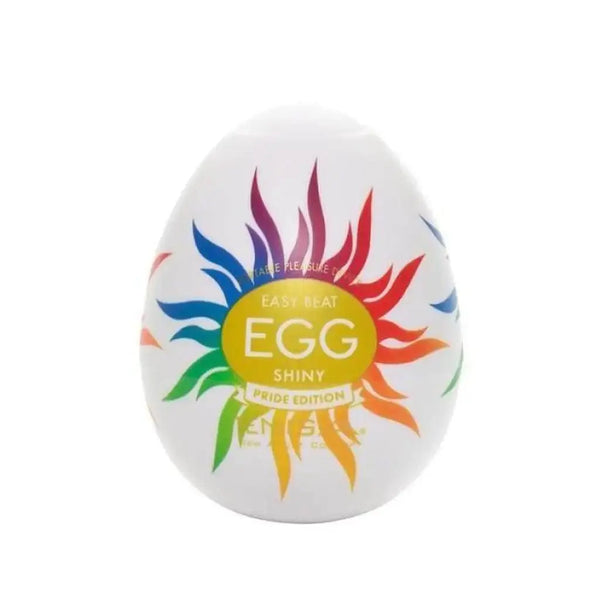 Tenga Egg Shiny Pride Edition masturbator in white egg-shaped case with rainbow sunburst design
