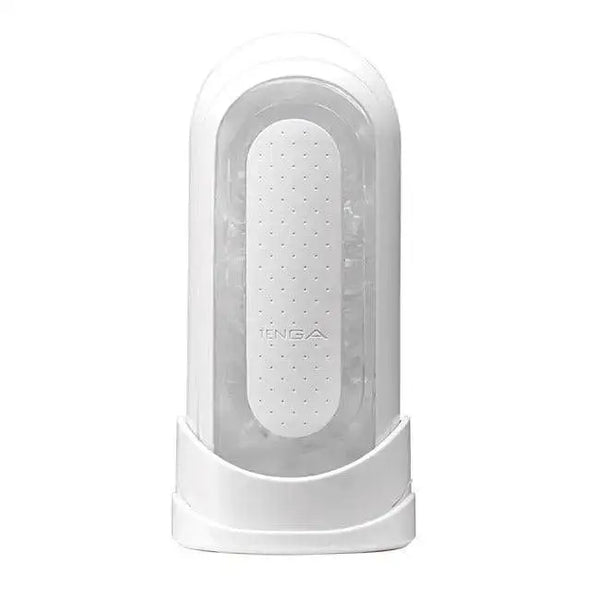 Tenga Flip Zero masturbator upright in white base, clear shell with dotted pressure pad visible