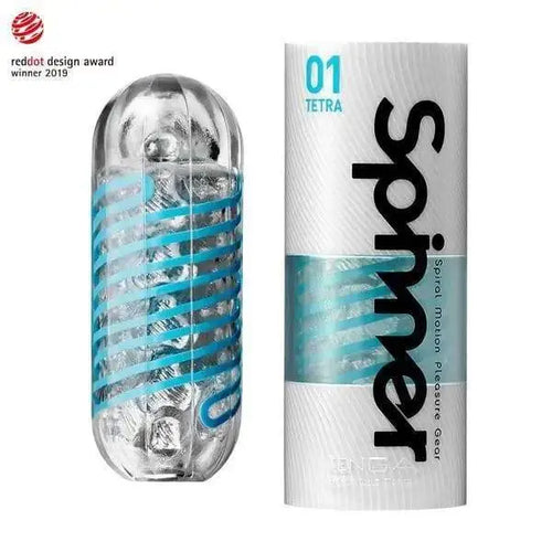 Tenga Spinner Tetra masturbator beside its cylindrical white packaging with teal branding
