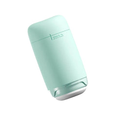 Tenga Puffy lying flat in mint green showing locked bottom seal position