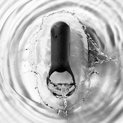 Tenga SVR+ black vibrating ring splashing in water, demonstrating waterproof capability