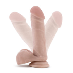 Three angles of the Coverboy Cowboy beige dildo showing suction cup base and realistic texture