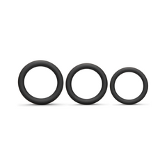 Three black silicone cock rings displayed side by side showing graduated size differences