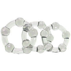 Three clear beaded cock rings overlapping, showing stretchy TPE construction and rounded bead detail
