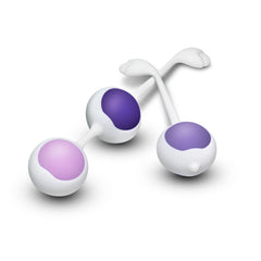 Three individual Blush Wellness kegel balls in purple and lavender displayed on white background