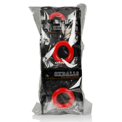 Three Oxballs OXR-1 red cock rings in sealed black retail bags, stacked upright bundle view