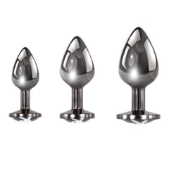 Three Playboy Pleasure gunmetal butt plugs displayed showing Bunny logo flared bases