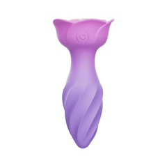 Three-quarter view of jewelled anal vibrator showing gradient purple-to-pink silicone finish