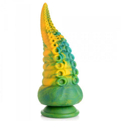 Three-quarter view of Monstropus dildo displaying green-yellow swirl coloring and raised tentacle rings