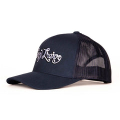 Three-quarter view of Sexy Living navy trucker hat showing curved brim detail