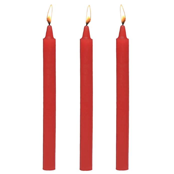 Three red Master Series Fire Sticks fetish drip candles with lit flames, made of paraffin wax