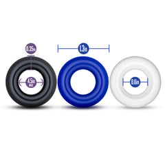 Three Stay Hard cock rings in black, blue, and white showing 0.35in width and 4.5in max stretch