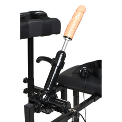 Close-up of thrusting machine arm with realistic dildo attachment mounted to chair seat rail
