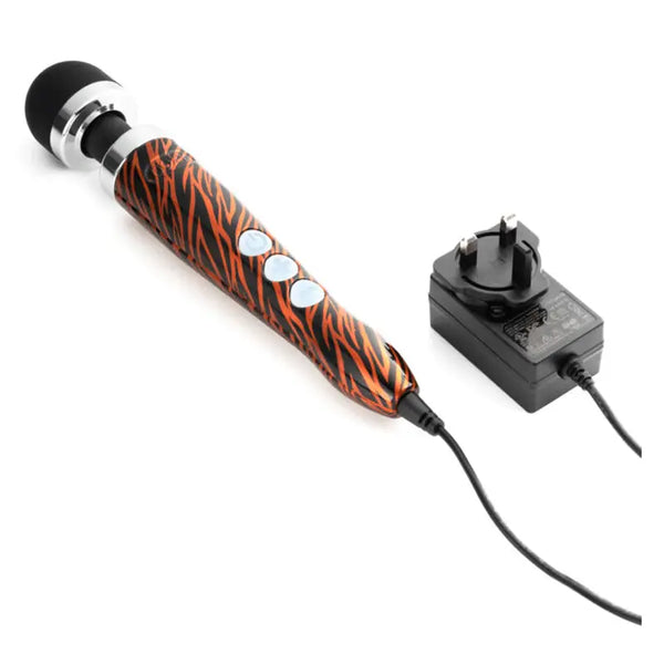Tiger-print Doxy wand massager lying flat with corded UK plug power adapter connected