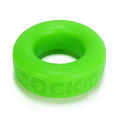 Top-angle close-up of COCK-T cock ring displaying textured outer surface and embossed brand text
