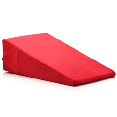 Top-angle view of red high-density foam wedge pillow with smooth microfiber outer cover and seams