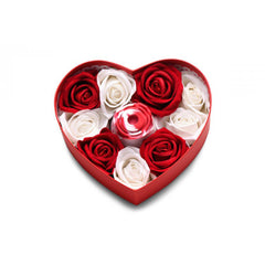 Top-down view of heart box with rose stimulator centered among red and white soap roses