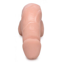 Top-down view of light-tone packer dildo highlighting realistic shape and smooth finish