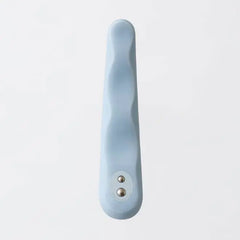Top-down view of MINAMO vibrator highlighting wavy silicone texture and dual contacts
