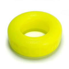 Close-up top-down view of Oxballs COCK-T acid yellow silicone cockring showing smooth texture