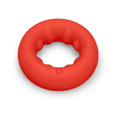 Top-down view of red silicone cock ring revealing ridged interior grip channel