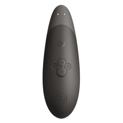 Top-down view of Womanizer Enhance showing soft-touch control buttons and LED indicators