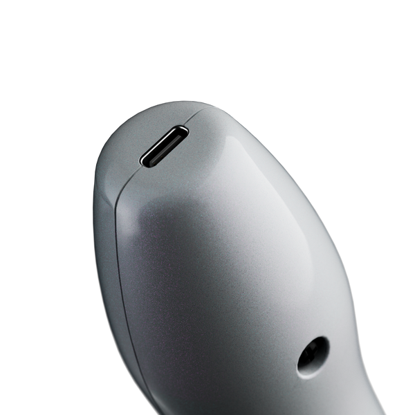 Top view of the Doxy wand tip showing USB-C charging port and indicator light on grey body
