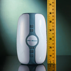 Touchdown stroker beside ruler showing approximately 6 inches tall, teal control panel
