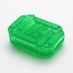 Translucent green Tenga Uni Emerald toy removed from packaging, showing ridged exterior