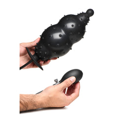 Two-hand view demonstrating fully inflated plug size alongside quick-release valve detail
