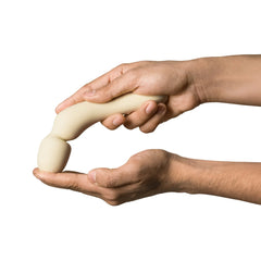 Two hands demonstrating the Dame Min Mini Wand's flexible shaft, bending the neck toward the head