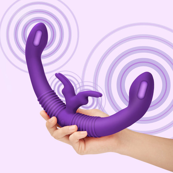 Two hands holding Together Couples Vibrator against purple background with vibration motion rings