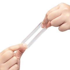 Two hands stretching the clear cock ring wide apart, showing high-elongation ultra-stretch material