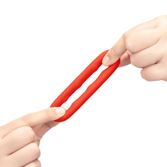Two hands stretching the Flex Ring Grip cock ring to demonstrate high-stretch elasticity