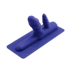 Close-up of Two-Nicorn textured shafts and ribbed base pad in deep blue sparkle silicone