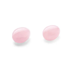 Two oval rose quartz yoni eggs with smooth polished surface, shown unhoused
