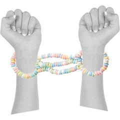 Two wrists bound together by multicolored pastel candy bead bracelets forming edible cuffs