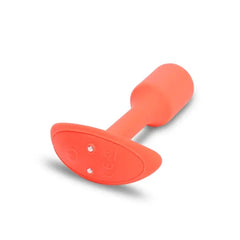 Underside of b-Vibe Vibrating Snug Plug 1 showing control buttons and charging port on base