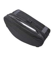 Underside of black positioning wedge showing zippered base panel and storage compartment