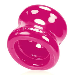Underside close-up of Oxballs Squeeze Ball Stretcher showing dual raised inner rings