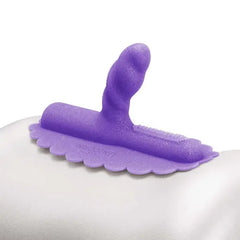 Uni Horn twisted silicone attachment resting on a white surface, showing textured bristle detail