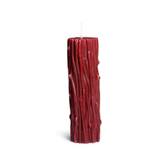 Unlit Master Series Thorn Drip Candle standing upright showing full ribbed red wax column